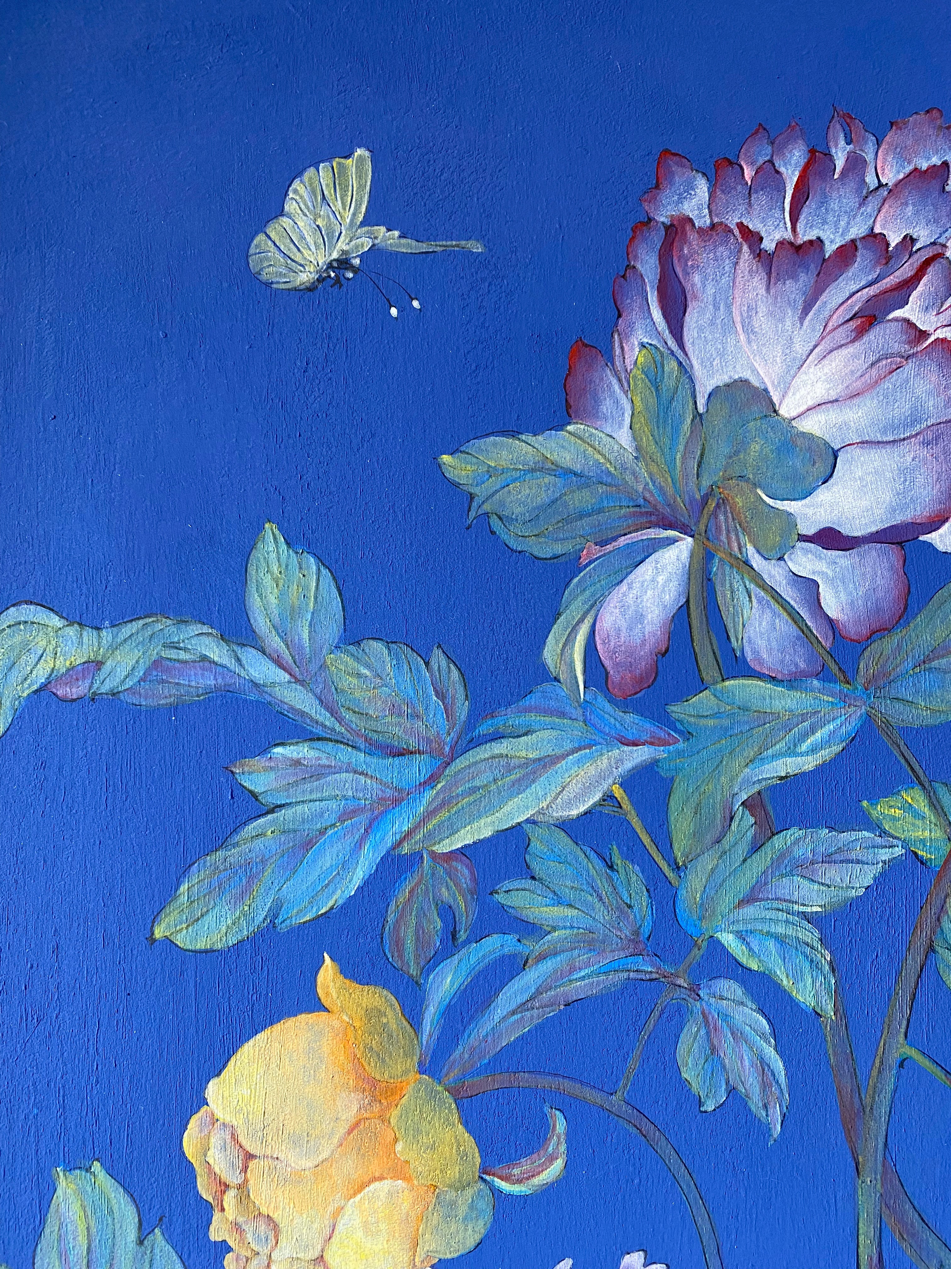 A close-up of a painted floral scene with large blue-purple flowers, green leaves, and a pale butterfly against a vivid blue background.